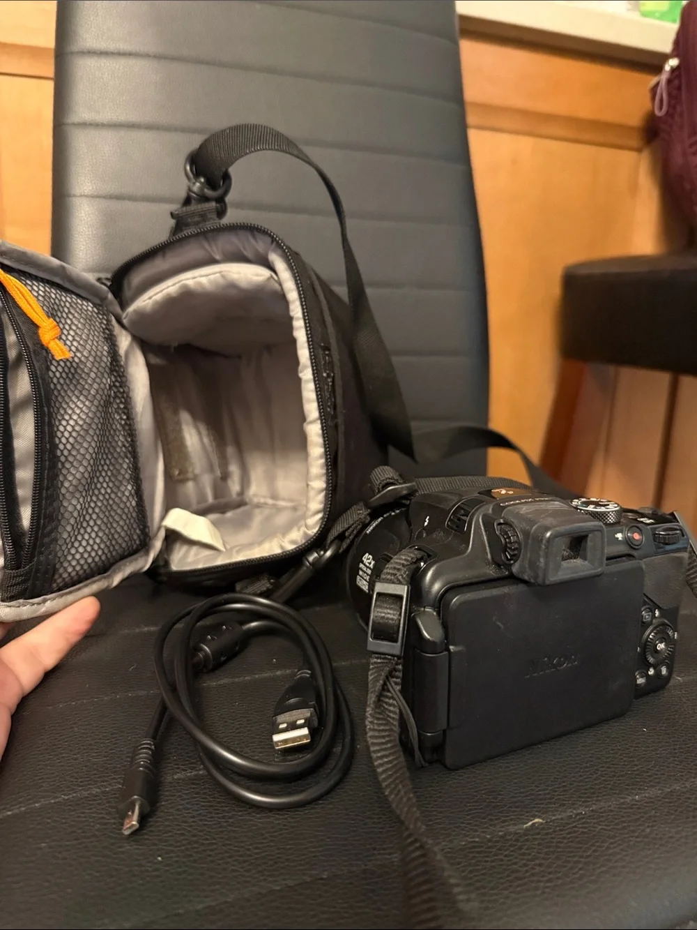 Nikon Black DSLR Camera with Black Lowepro Case and USB Cable
